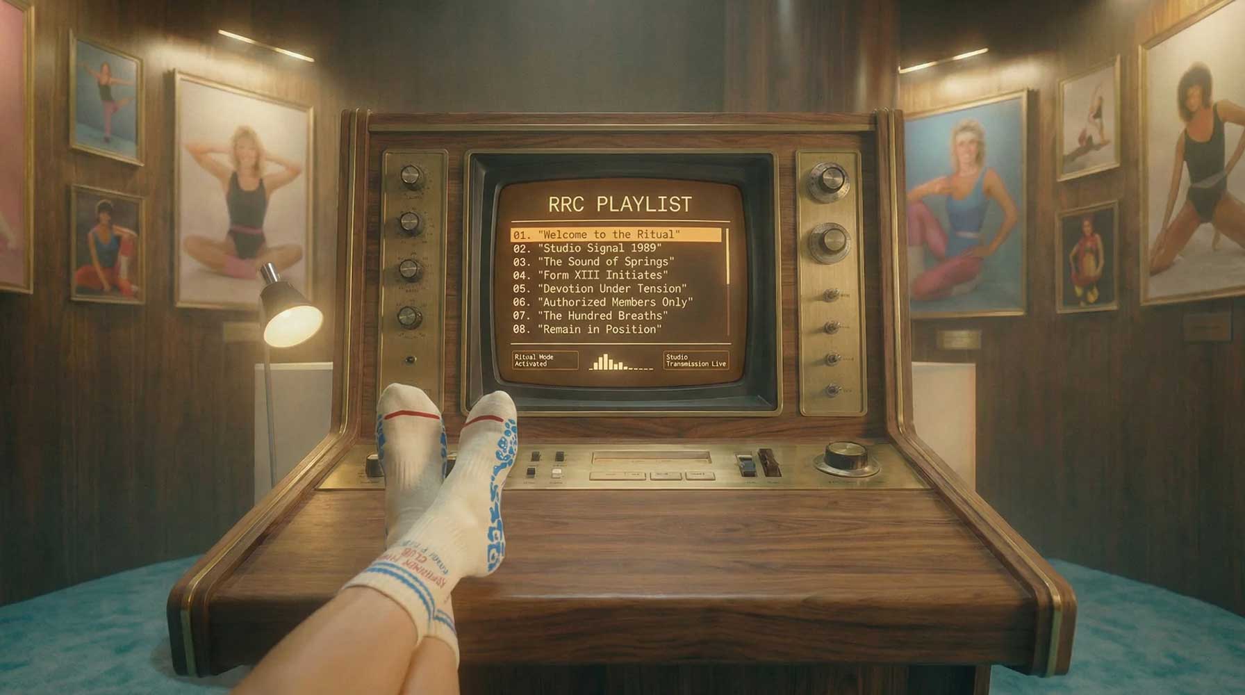 Vintage-style entertainment console with a screen displaying a 'RRC Playlist' in a room with framed pictures on the wall.